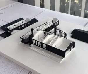 Une maquette architecturale de villa moderne imprimée en 3D avec des textures réalistes.